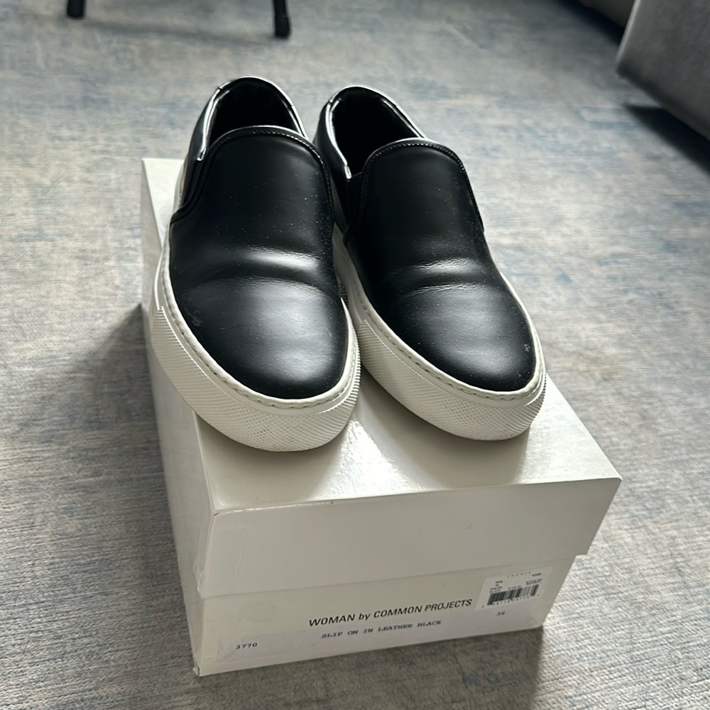 Women by Common Projects Black Leather Slip Ons sz EU36, US6